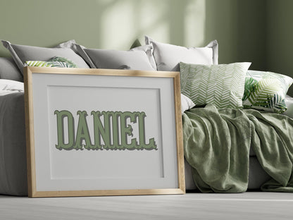 Custom baby name sign in green tones placed beside cozy green bedding, a perfect addition to baby nursery decor or as a custom baby gift.