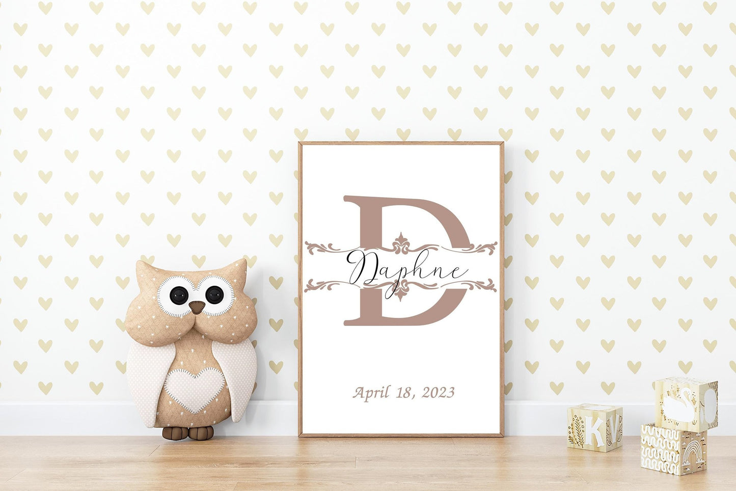 Custom baby name sign with a taupe initial styled with a plush owl and heart decor, perfect for nursery wall decor or personalized baby shower gifts.