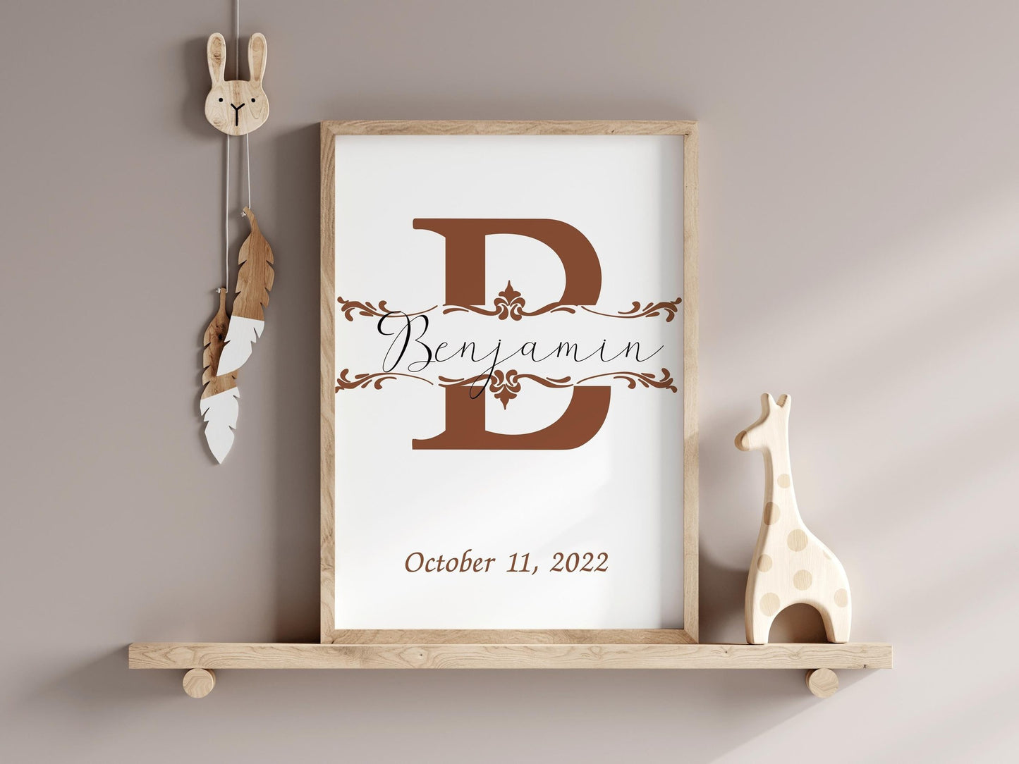 Custom baby name sign with a large rust-colored initial and elegant design, displayed in a neutral-toned nursery, perfect as a personalized baby gift.