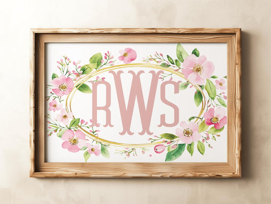 Wooden-framed wildflower name sign with blush pink initials, surrounded by soft florals, perfect for personalized gifts or nursery decor.