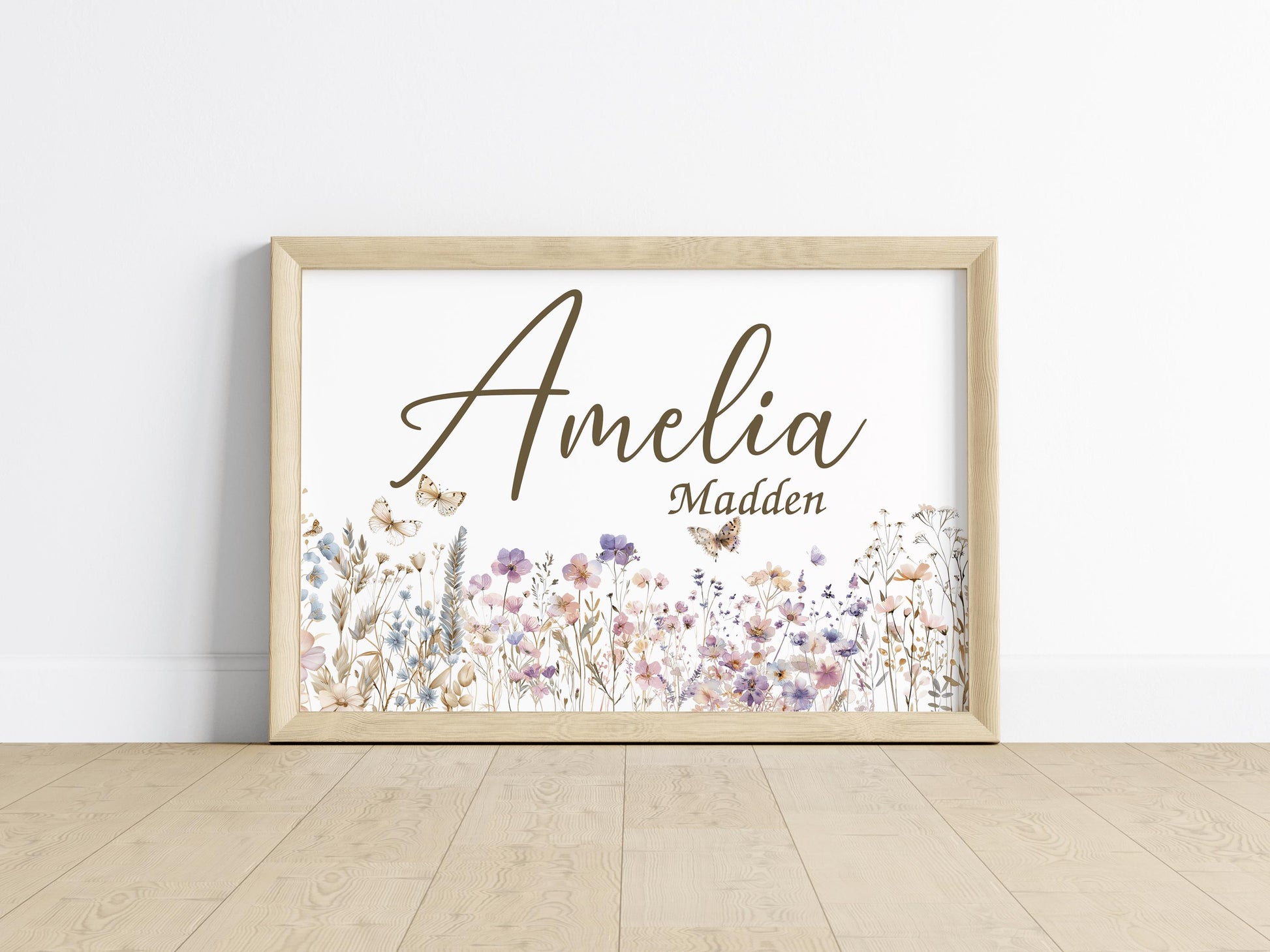 Personalized floral name sign on the floor with wildflower accents, a perfect piece for nursery decorations or custom baby gift.