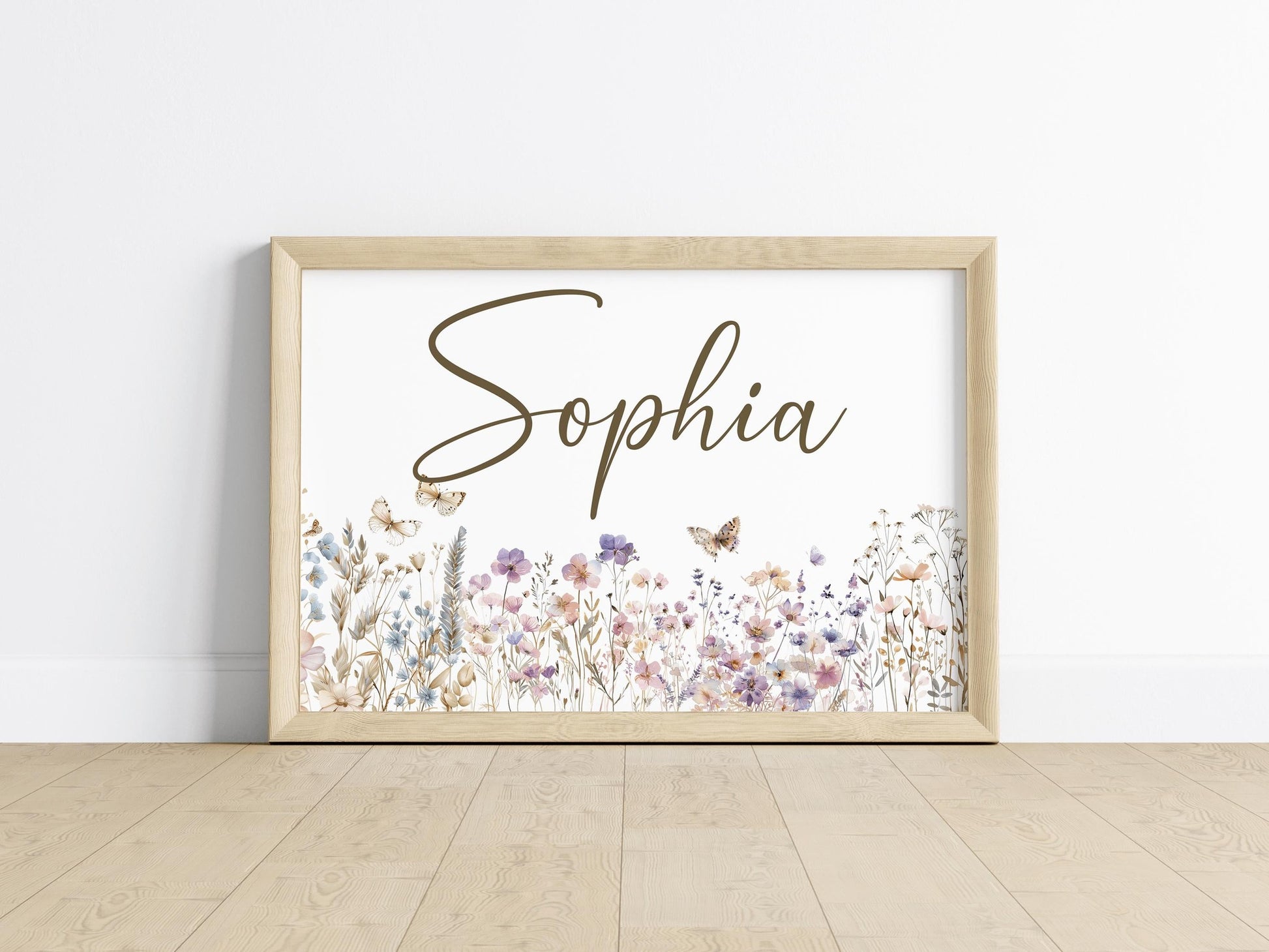 Elegant floral name sign framed in minimalist style on wooden floor, showcasing wildflower nursery decor for personalized gifts.