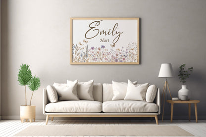 Custom wildflower name sign on a beige living room wall, blending boho nursery decor with personalized touches for homes.