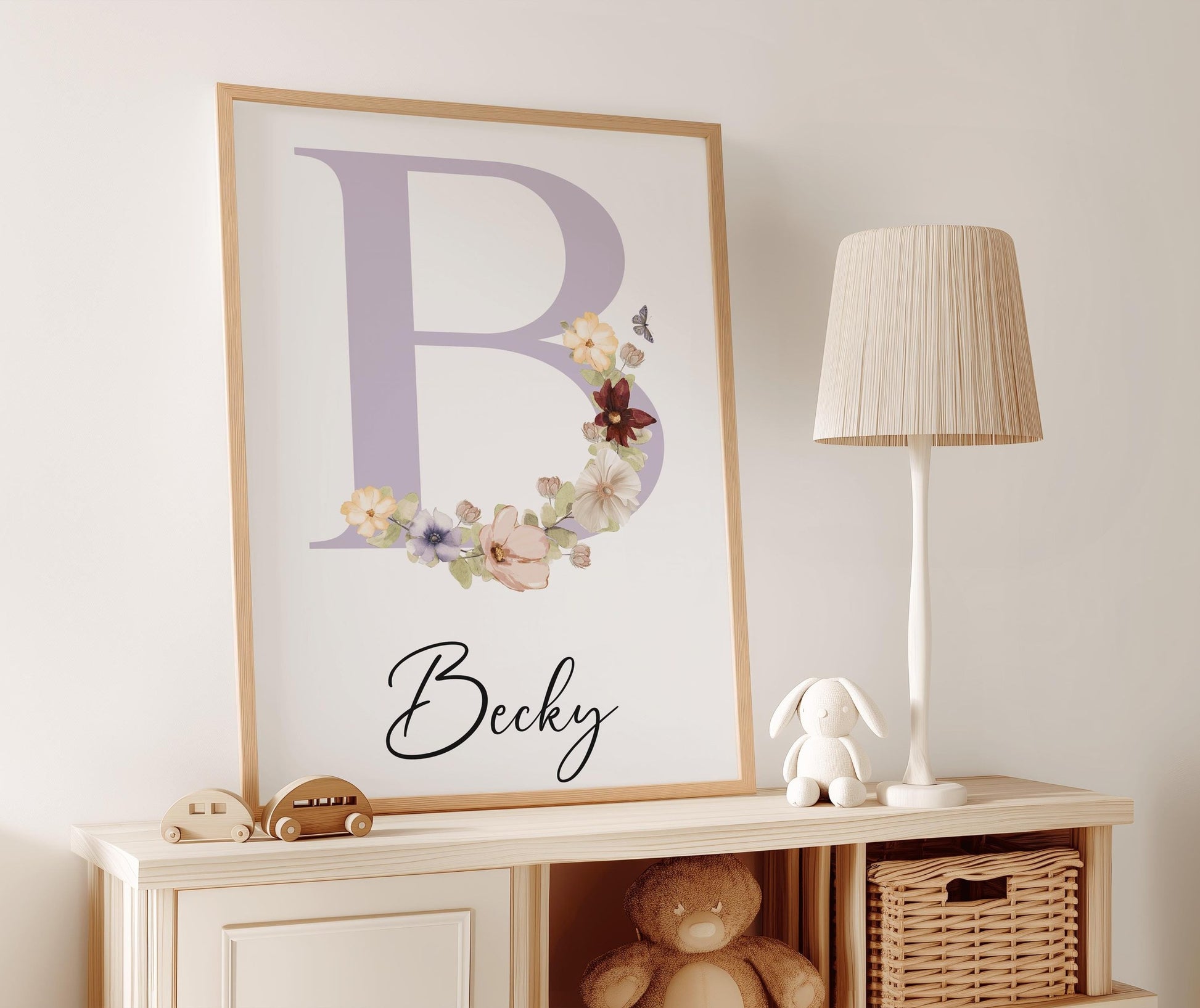 Elegant nursery name sign featuring a lavender initial adorned with wildflower illustrations and personalized text, perfect for boho nursery decor.