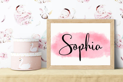 Personalized baby name sign of Sophia on pink watercolor background, styled on a nursery shelf with decorative boxes, an ideal custom baby gift and nursery decor.