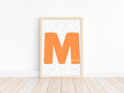 Custom nursery initial name sign with large orange letter M and dotted background, ideal for nursery wall decor or baby gift