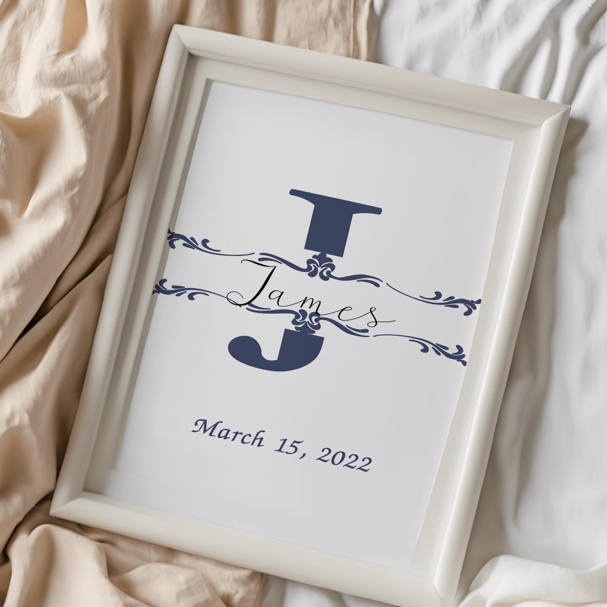 Custom baby name sign with a navy blue initial and elegant font, displayed on soft fabric, perfect as a baby gift or nursery wall decor.