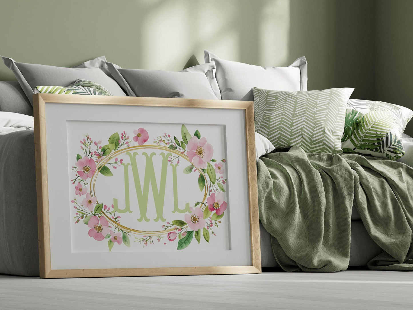 Custom floral nursery decor with green initials, framed with wildflowers, displayed in a stylish bedroom, perfect for boho nursery themes or personalized gifts.