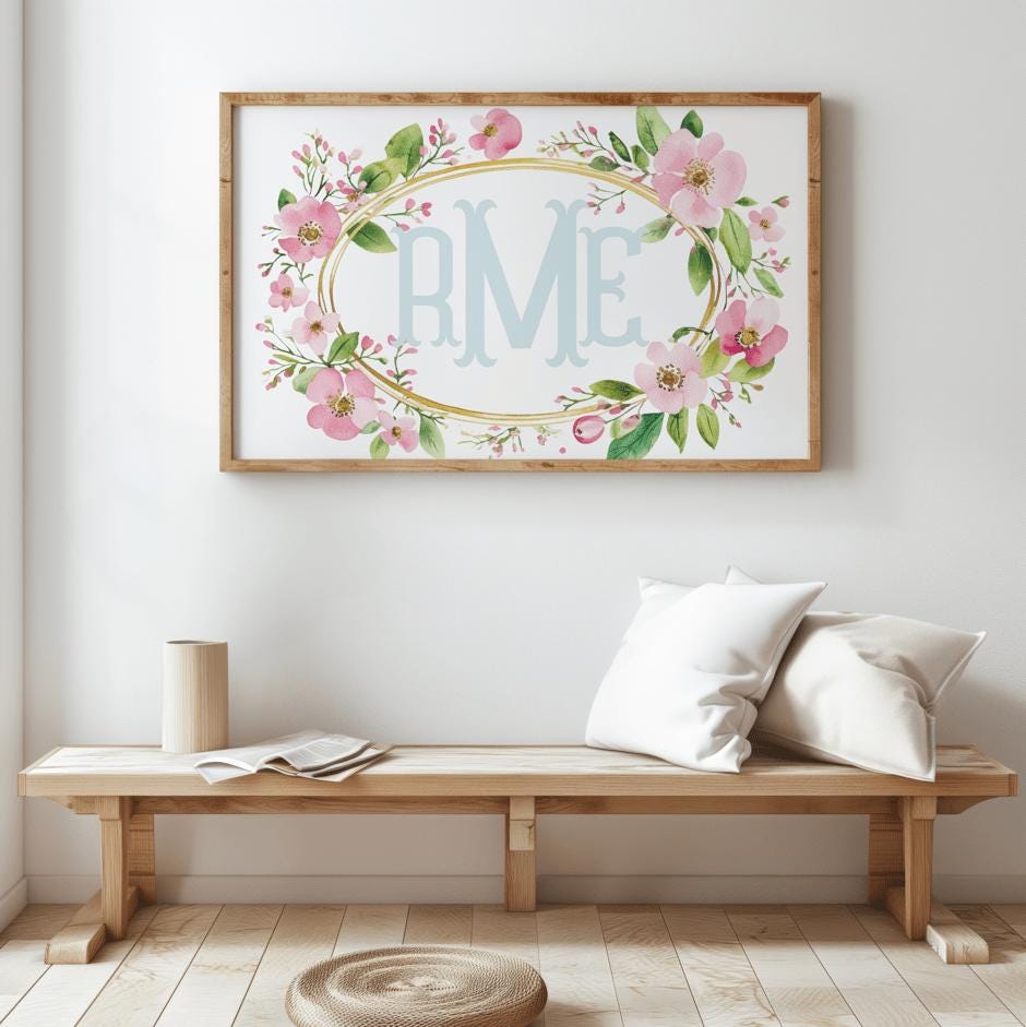 Custom wildflower nursery decor with blue initials surrounded by soft pink flowers, ideal for a baby shower gift or nursery decoration.