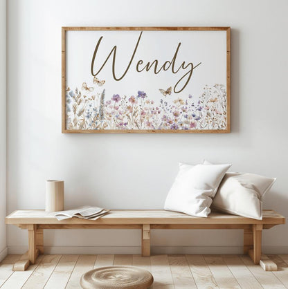 Custom wildflower name sign on wooden bench in minimalist decor, showcasing floral nursery decor for a newborn name sign