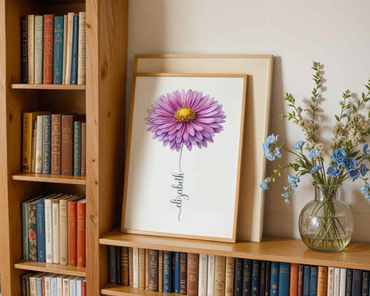 A purple daisy flower print displayed on a wooden bookshelf, blending custom flower name sign art with bookish aesthetics.