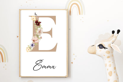 Sophisticated name sign featuring a beige initial surrounded by floral designs, perfect for wildflower nursery decor or a new baby gift.