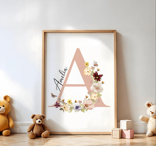 Large peach initial adorned with intricate wildflowers and a personalized name, displayed in a bright and playful nursery space.