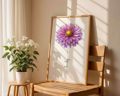 A stylish woman holding a framed purple daisy artwork, creating a unique and elegant flower name sign for home decor.