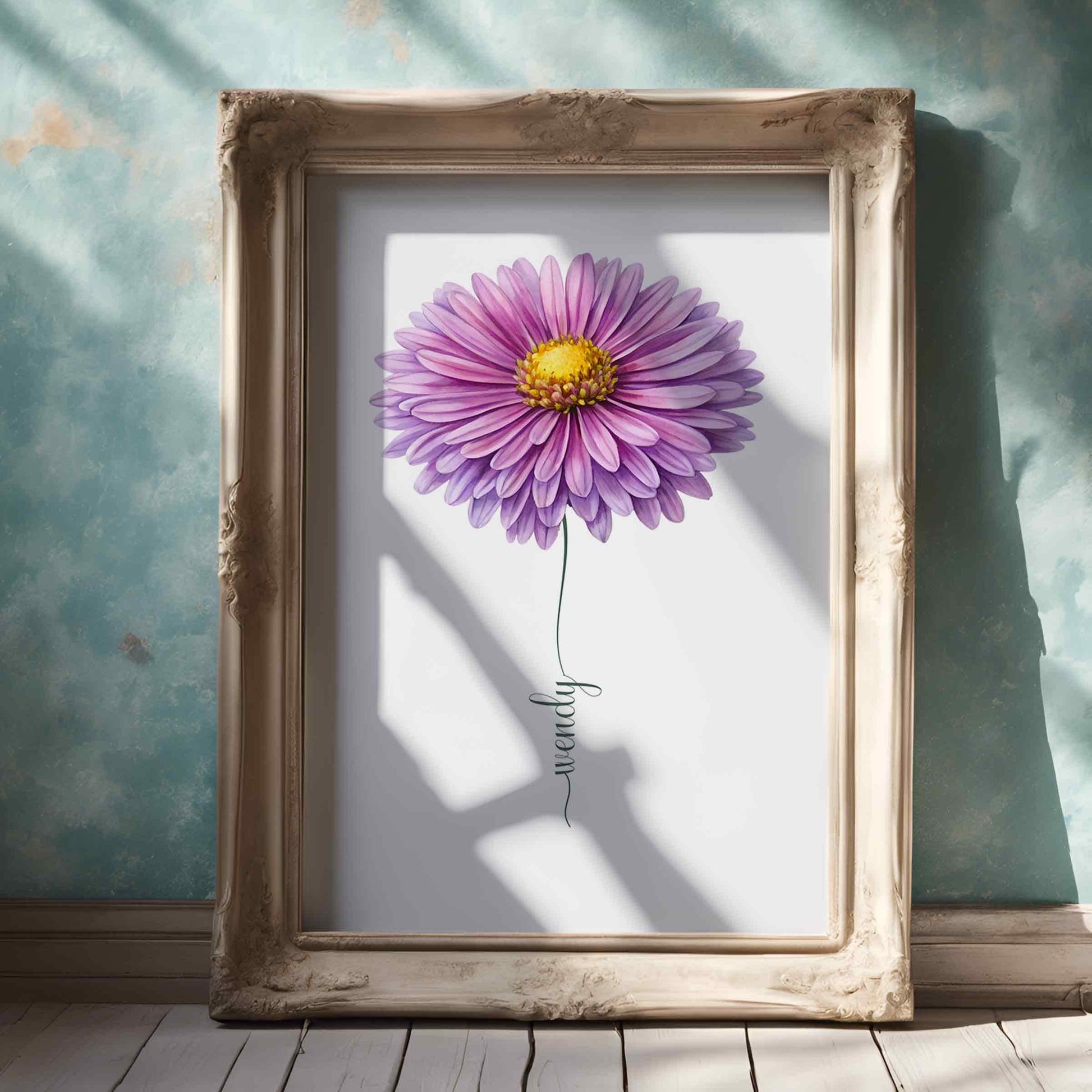 A smiling woman holding a framed purple daisy flower print, ideal for adding a personal touch with a flower name sign in any space.