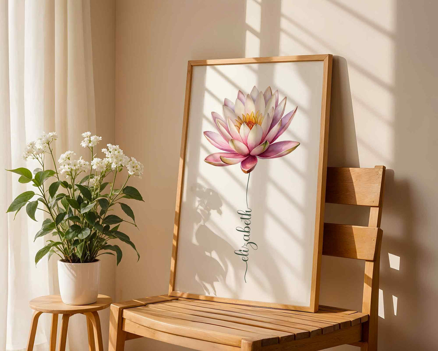 A framed pink lotus flower name sign displayed by a window with a scenic view, adding a unique personalized decor element.